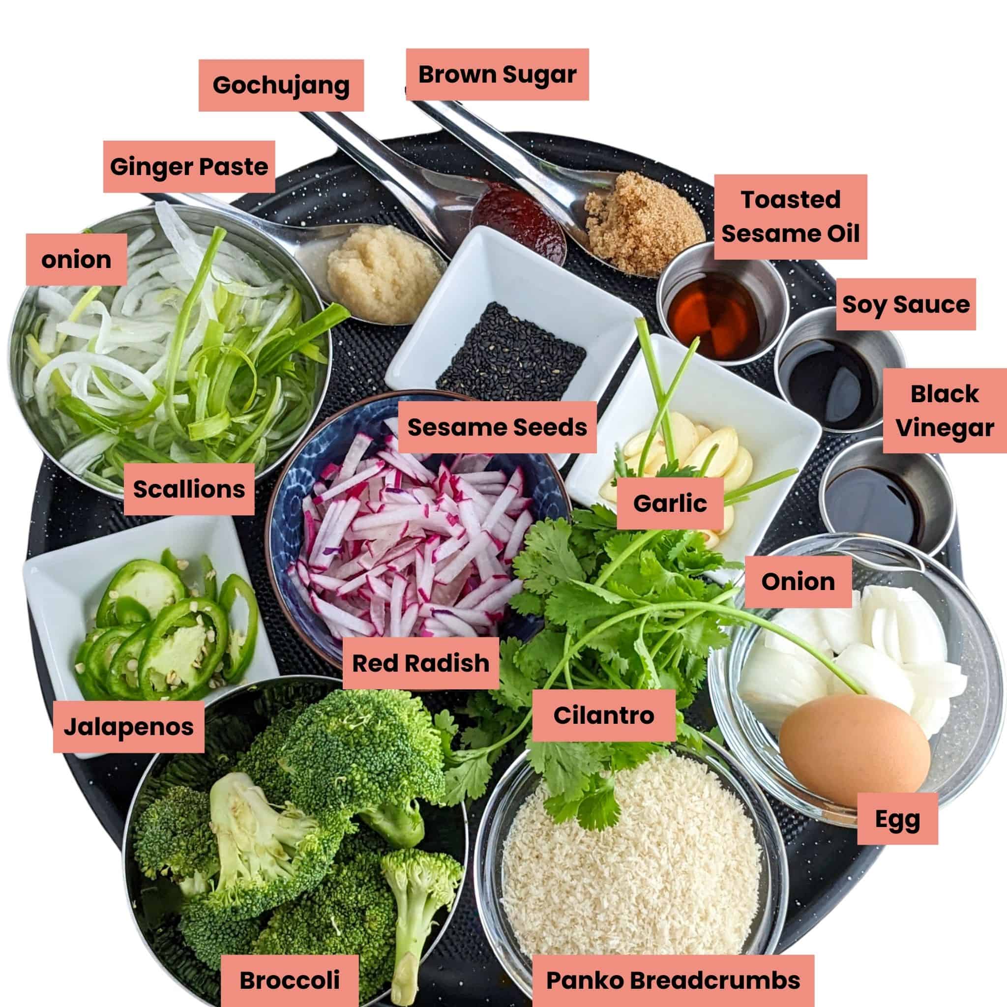 ingredients for the gochujang chicken stir-fry in containers, labeled on a large round tray