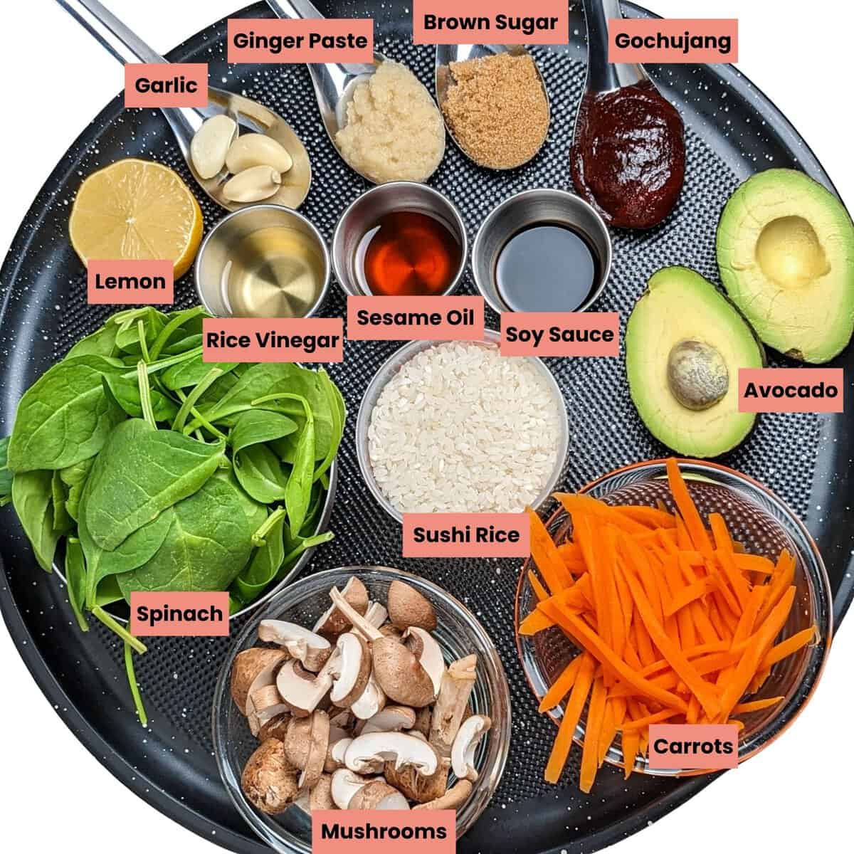 ingredients for the salmon chili rice bowl in containers on a large round tray.