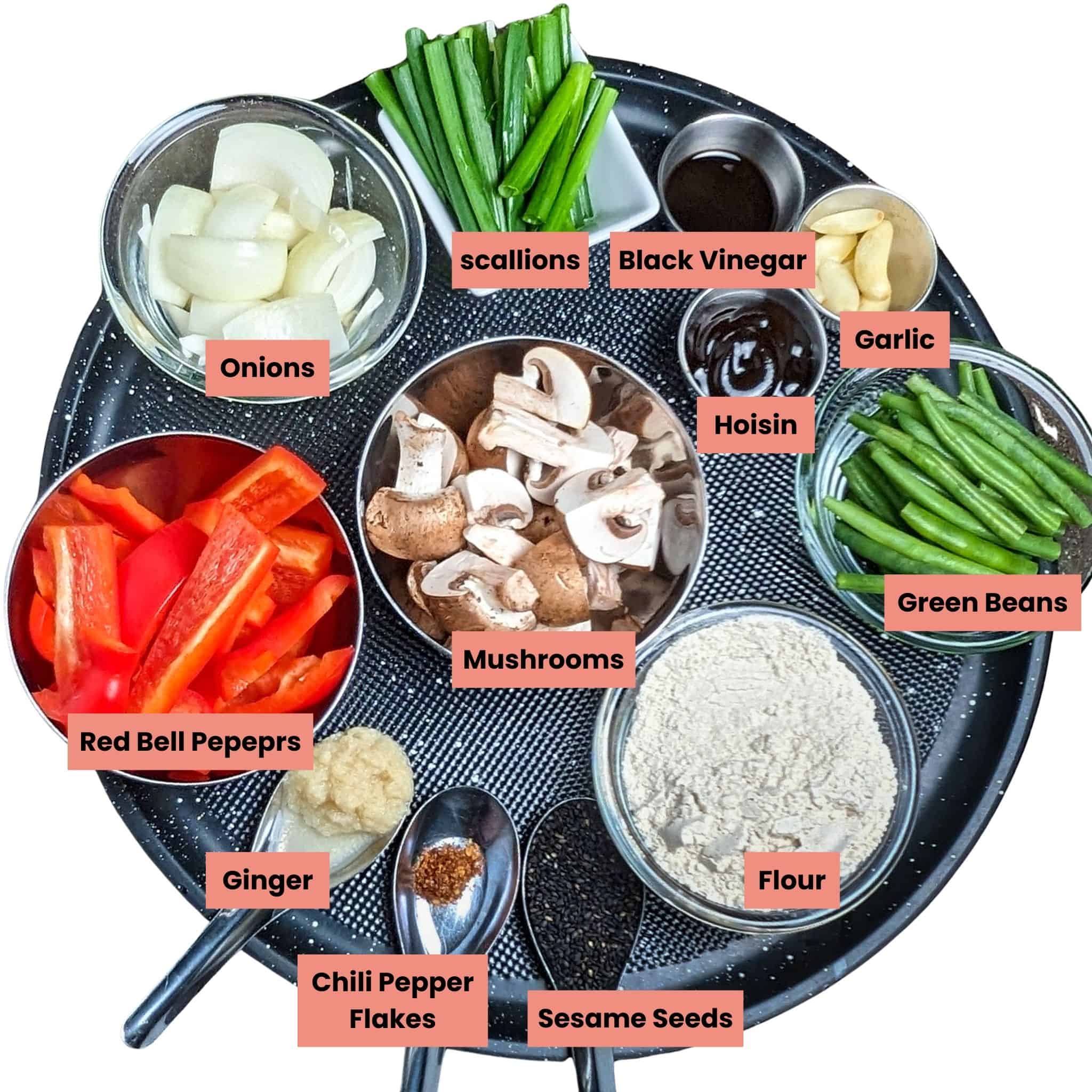 Ingredients for the hoisin chicken recipe on a round large tray in containers.