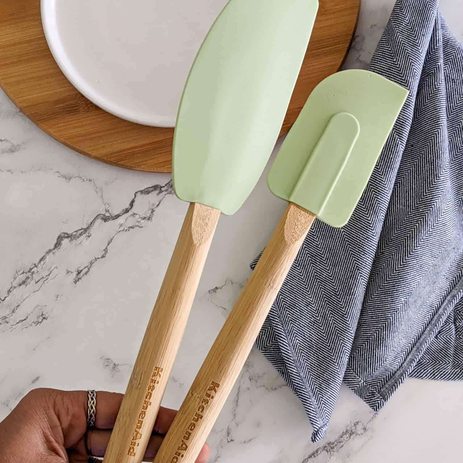 a pair of KitchenAid bamboo spatula