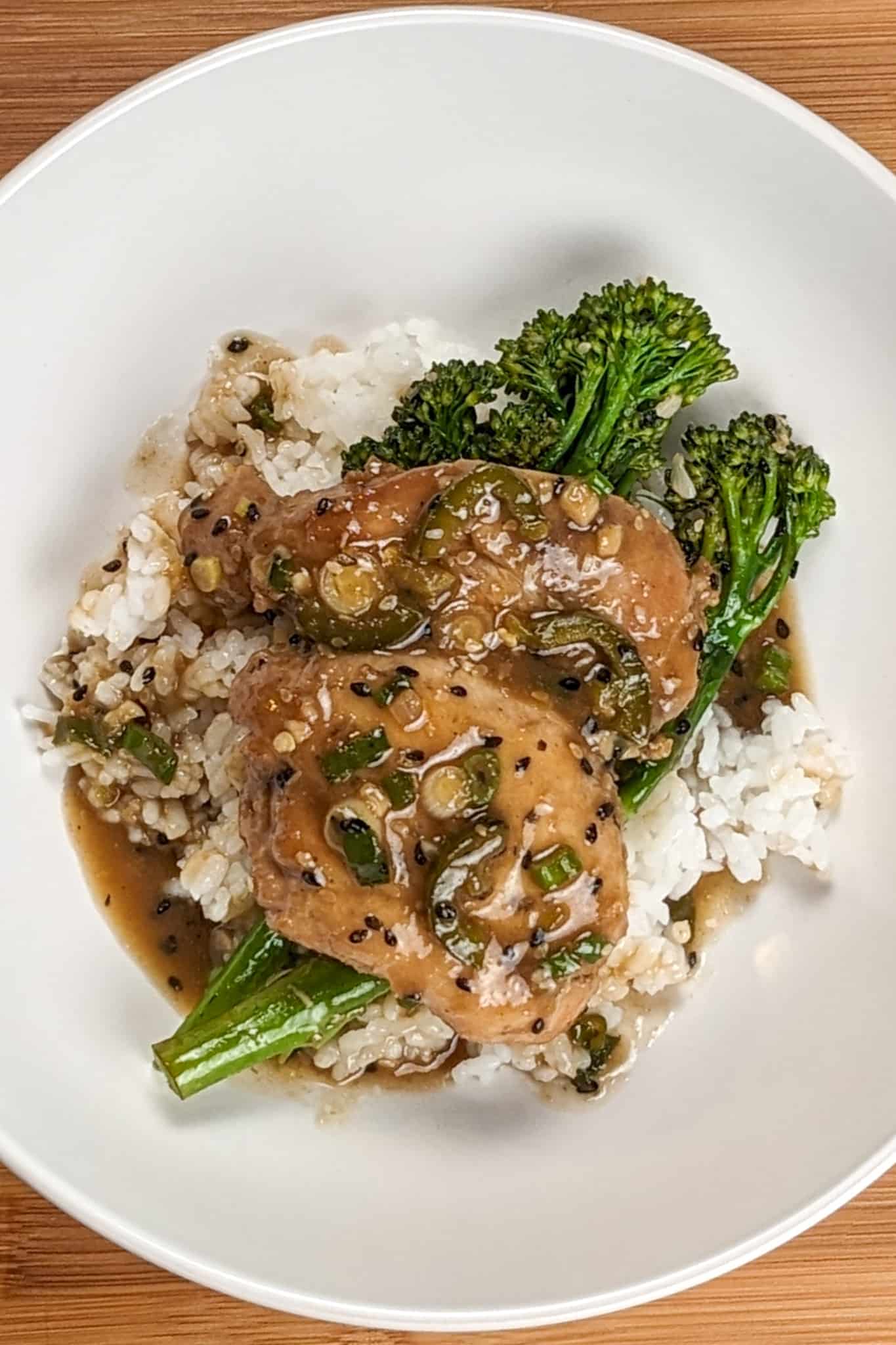 top view of the Spicy Honey Jalapeno Lime Chicken with Broccolini om a wide round bowl.
