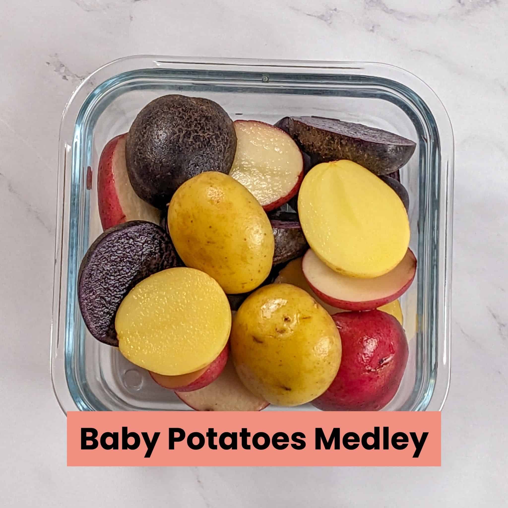 halved medley of baby potato in a square glass container.