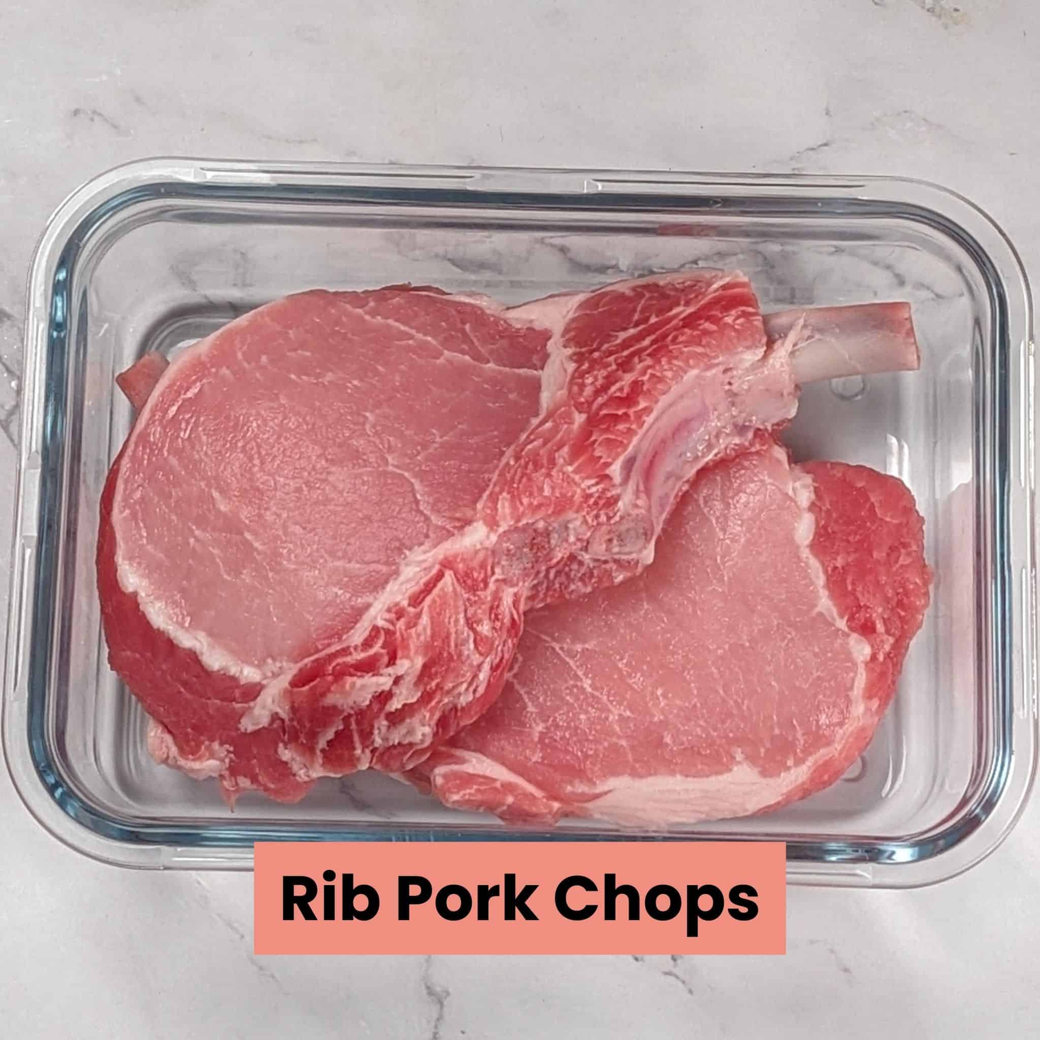 rib pork chops in a rectangle glass container.