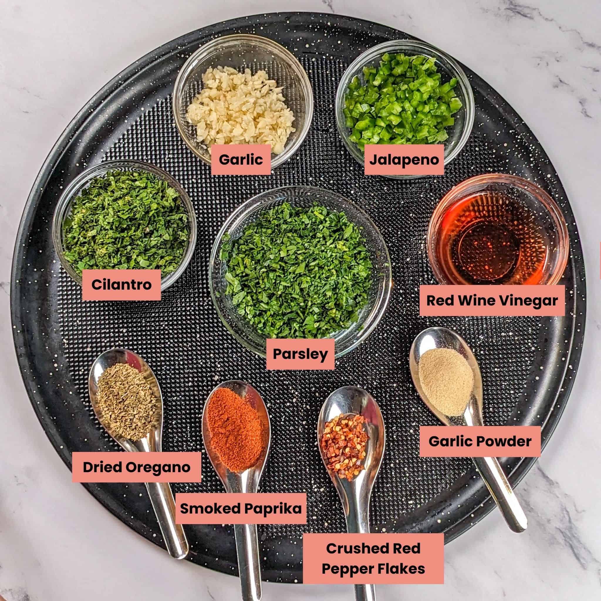 ingredients for the Grilled Steak Spicy Chimichurri Baby Potatoes and Broccoli in containers on a large round pizza pan.