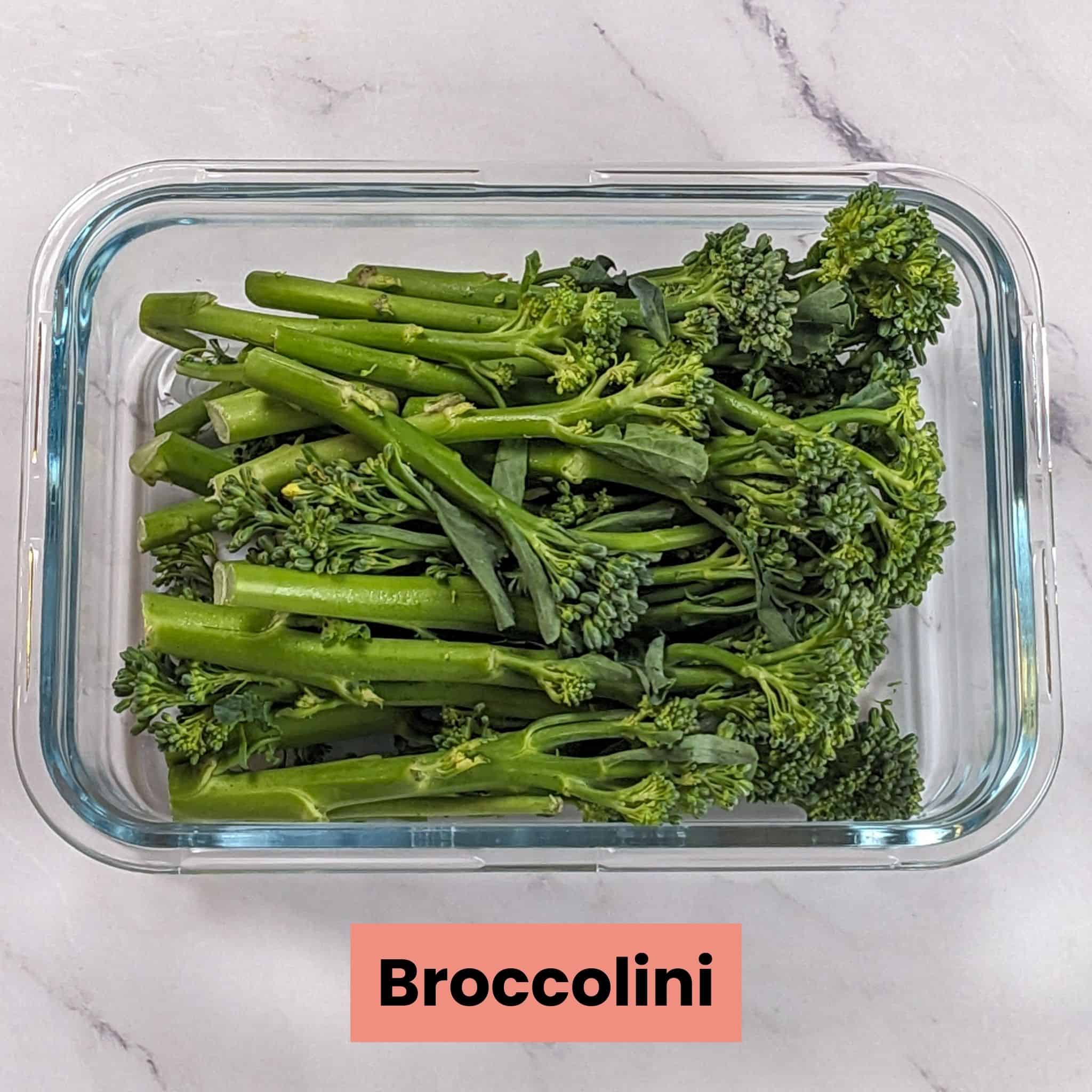 broccolini in a rectangle glass container.