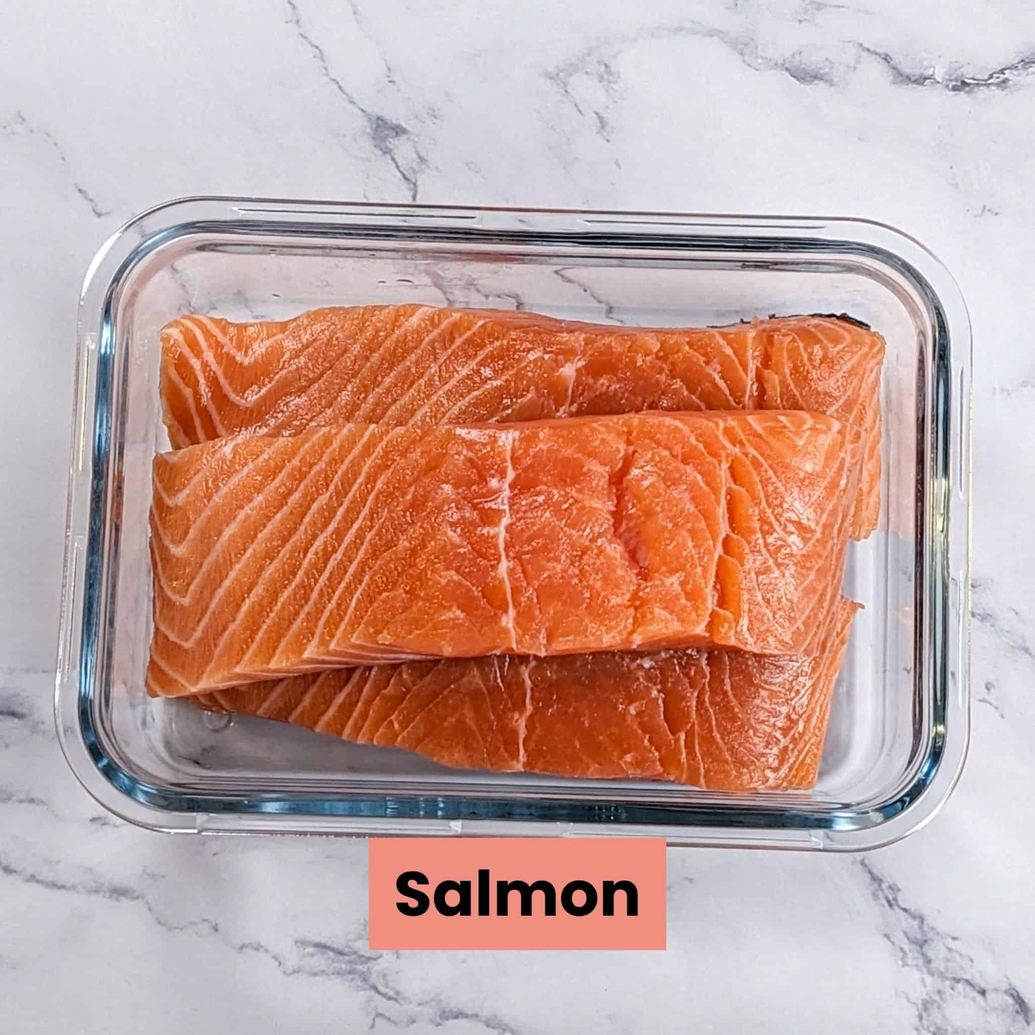 salmon filets in a rectangle glass dish.