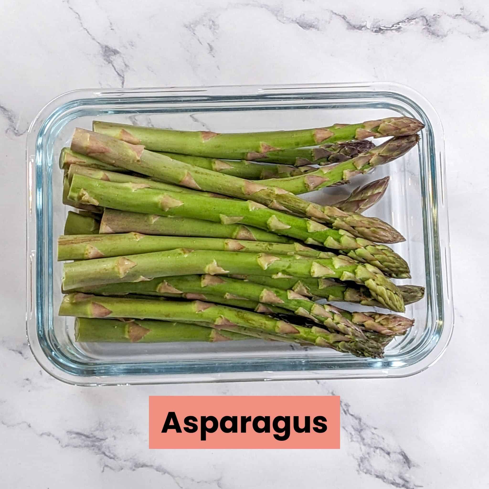 jumbo asparagus in a glass rectangle dish.