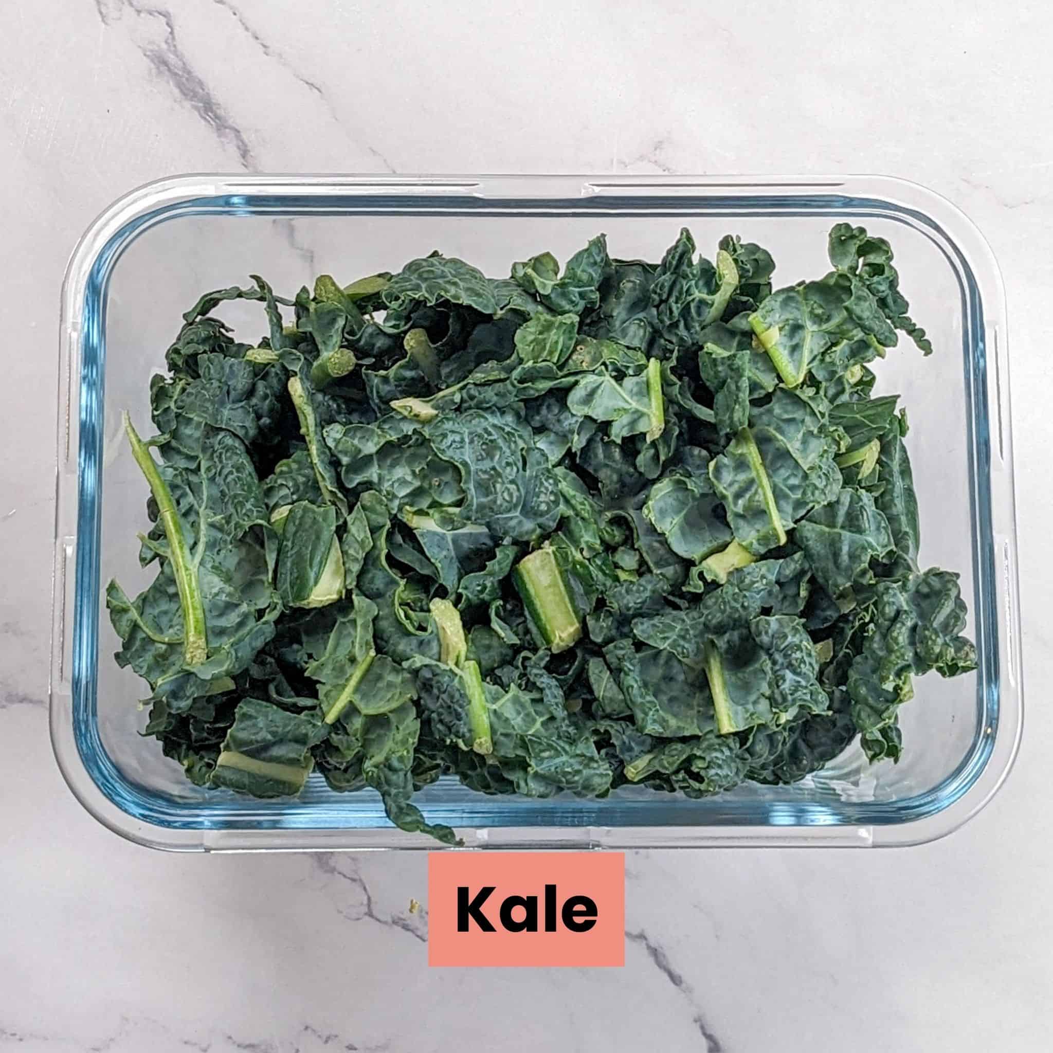 shredded kale in a glass rectangle container.