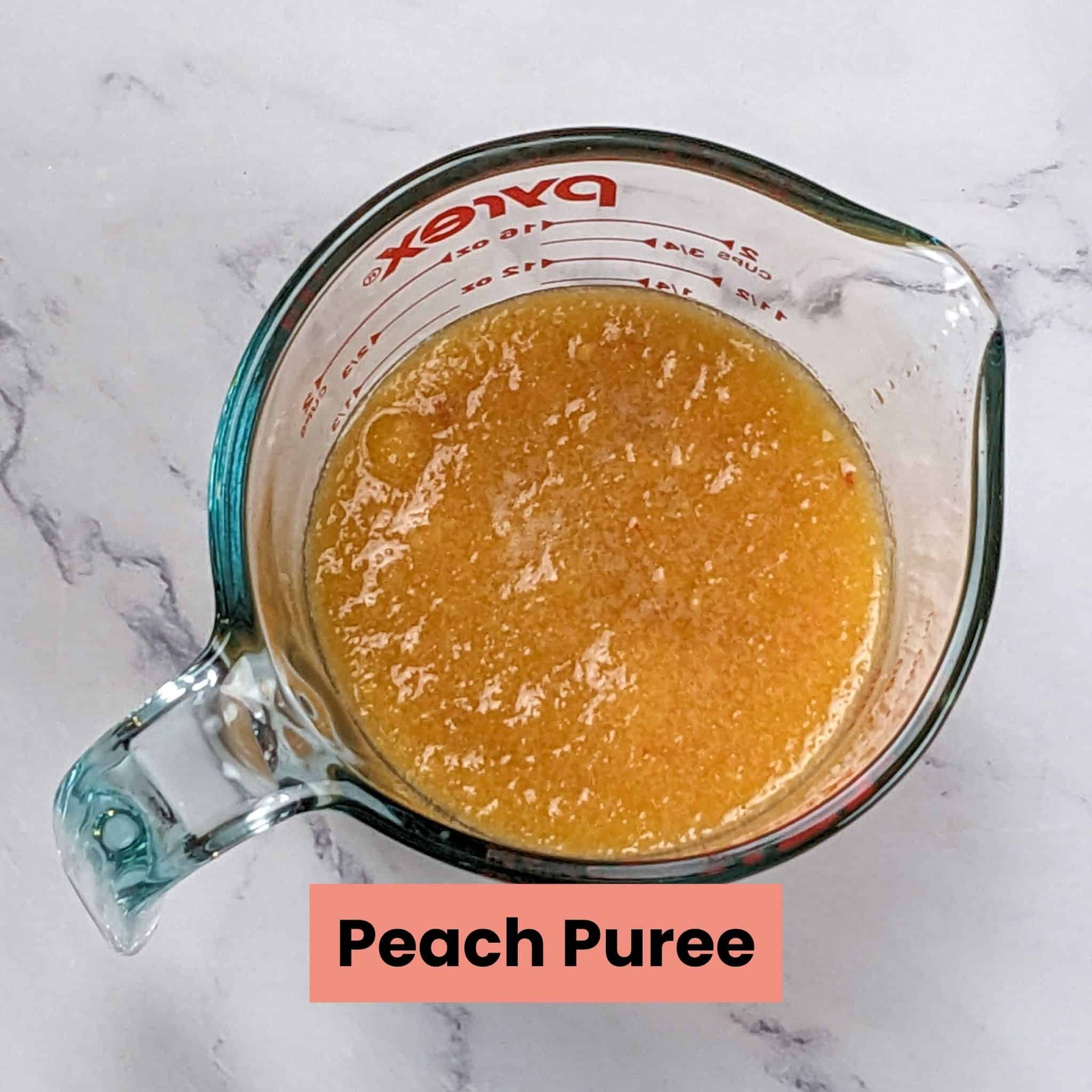 peach puree in a pyrex measuring cup.