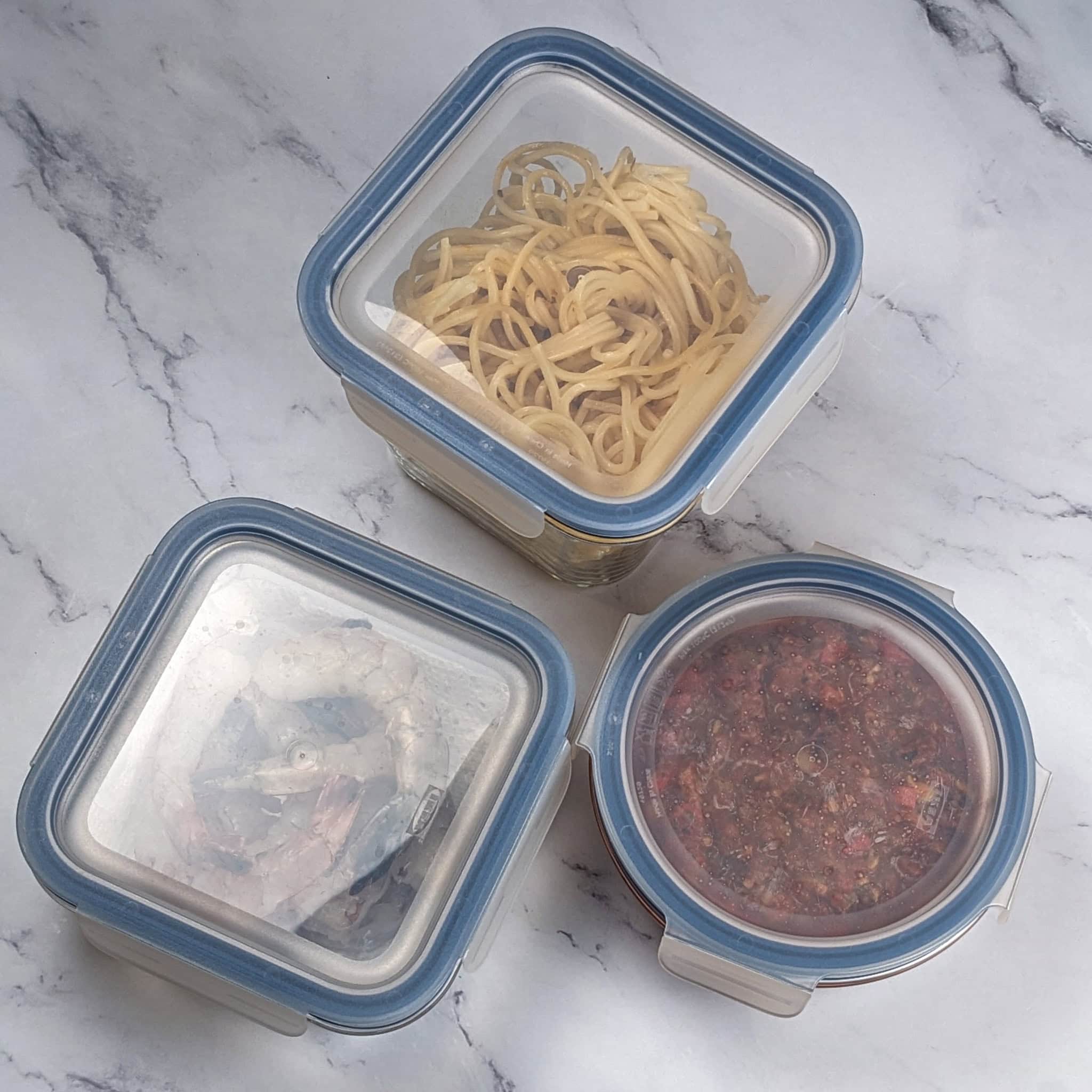 Leftovers in airtight glass containers with plastic clip-on lids.