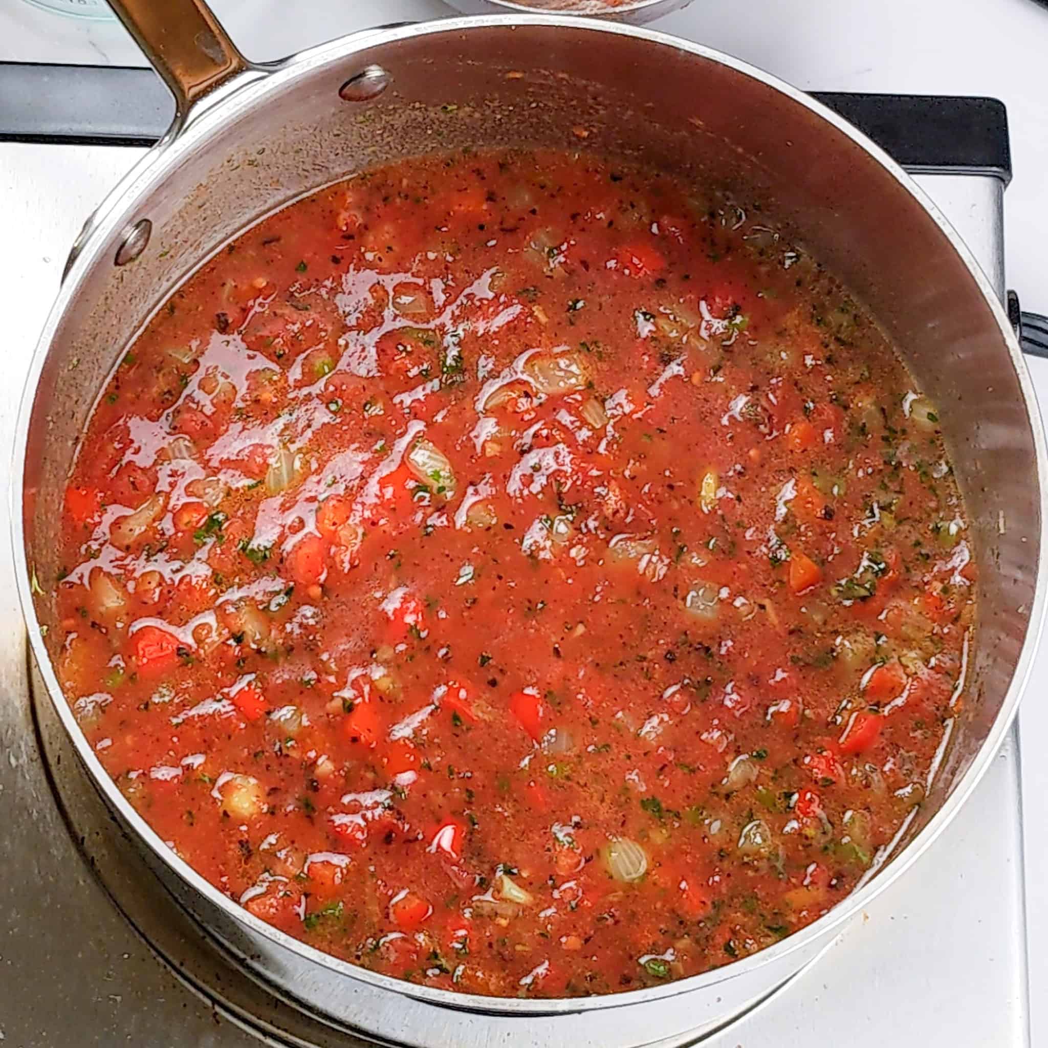 Tomato sauce base with the sauteed vegetables in the sauce pot.