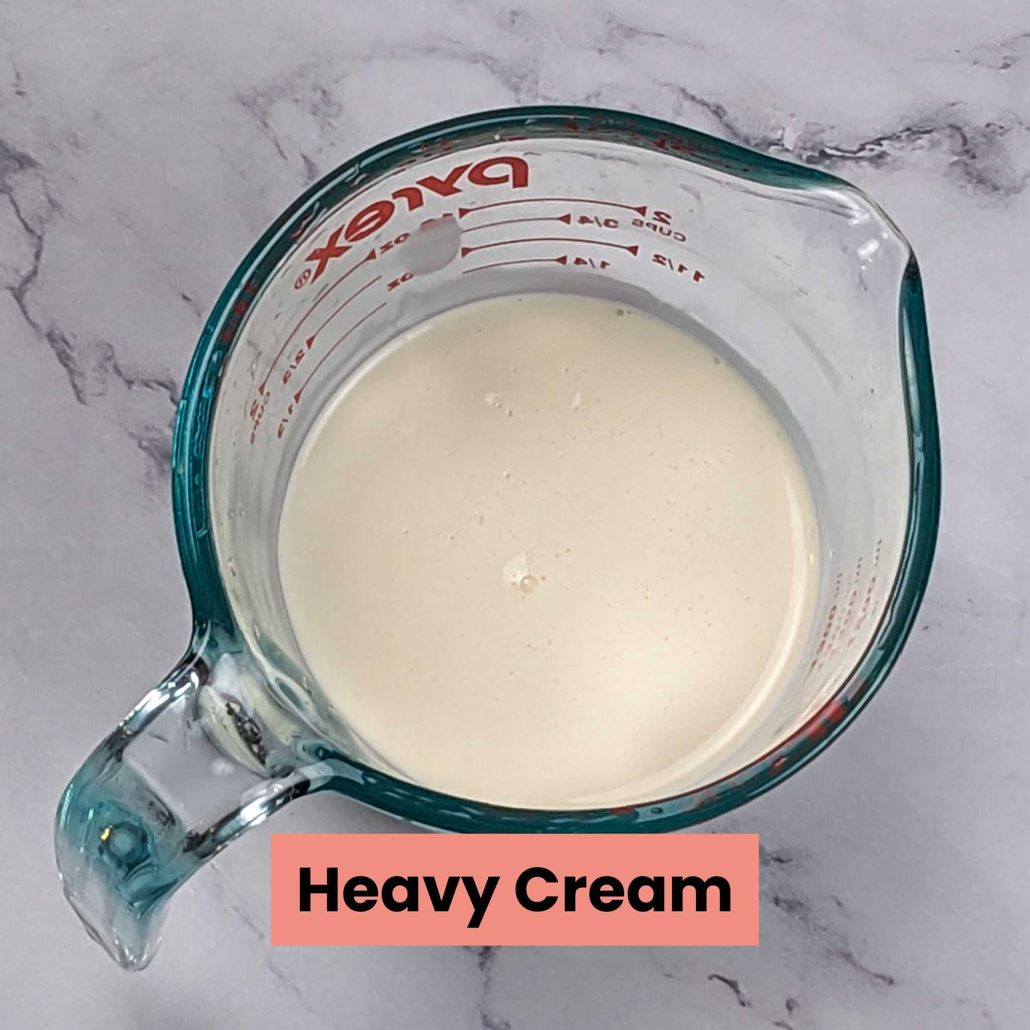 heavy cream in a pyrex measuring cup.