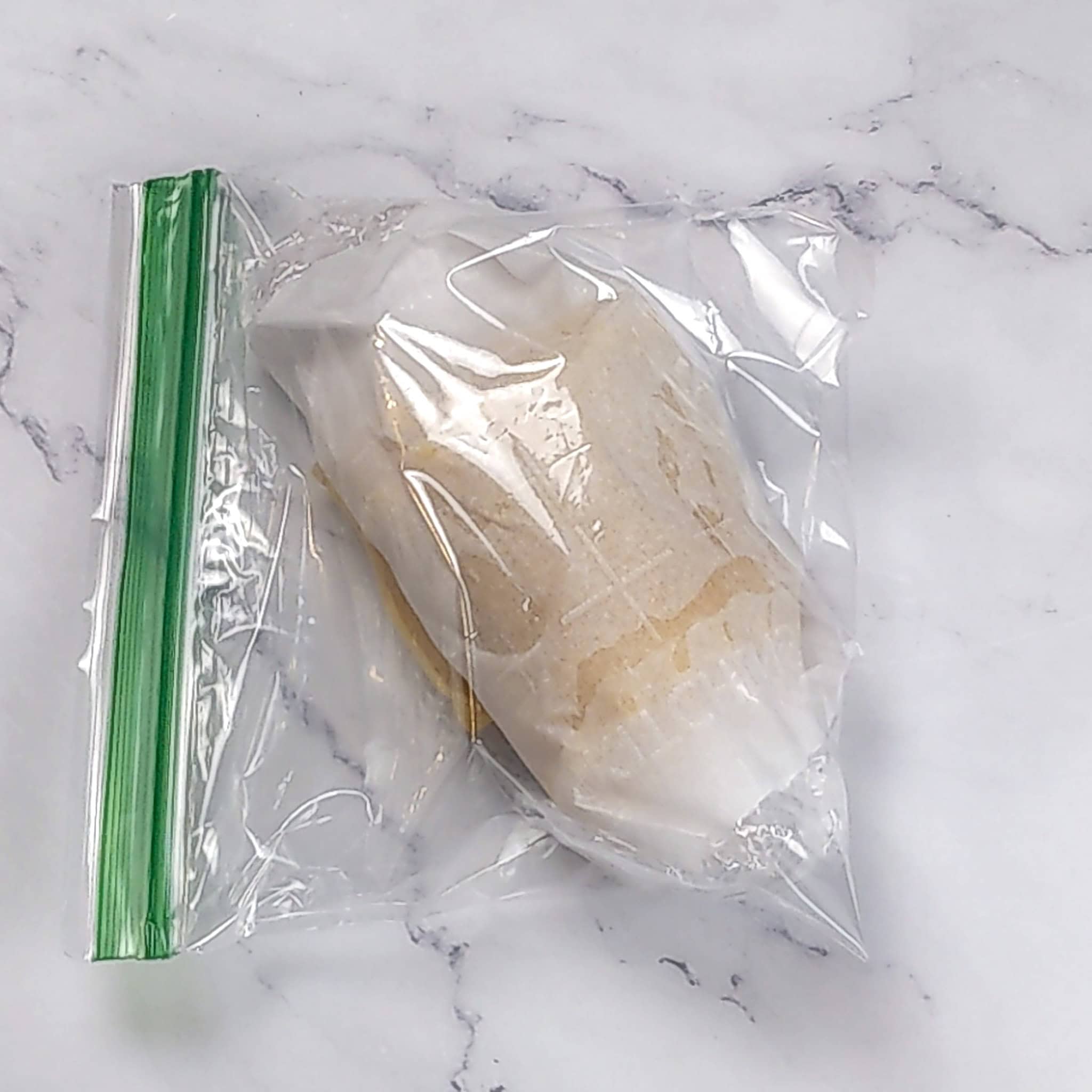 Rolled lasagna sheets in a resealable bag.