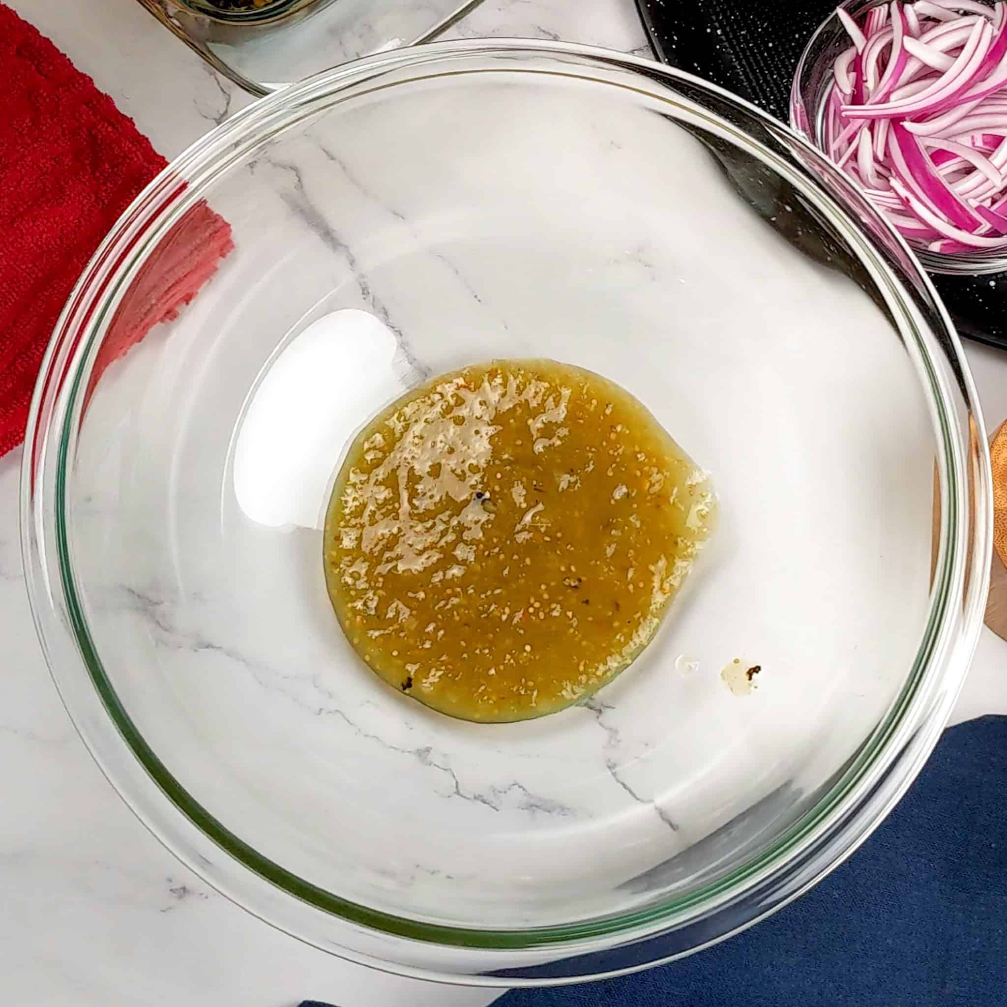 Salsa verde in a glass Pyrex mixing bowl.