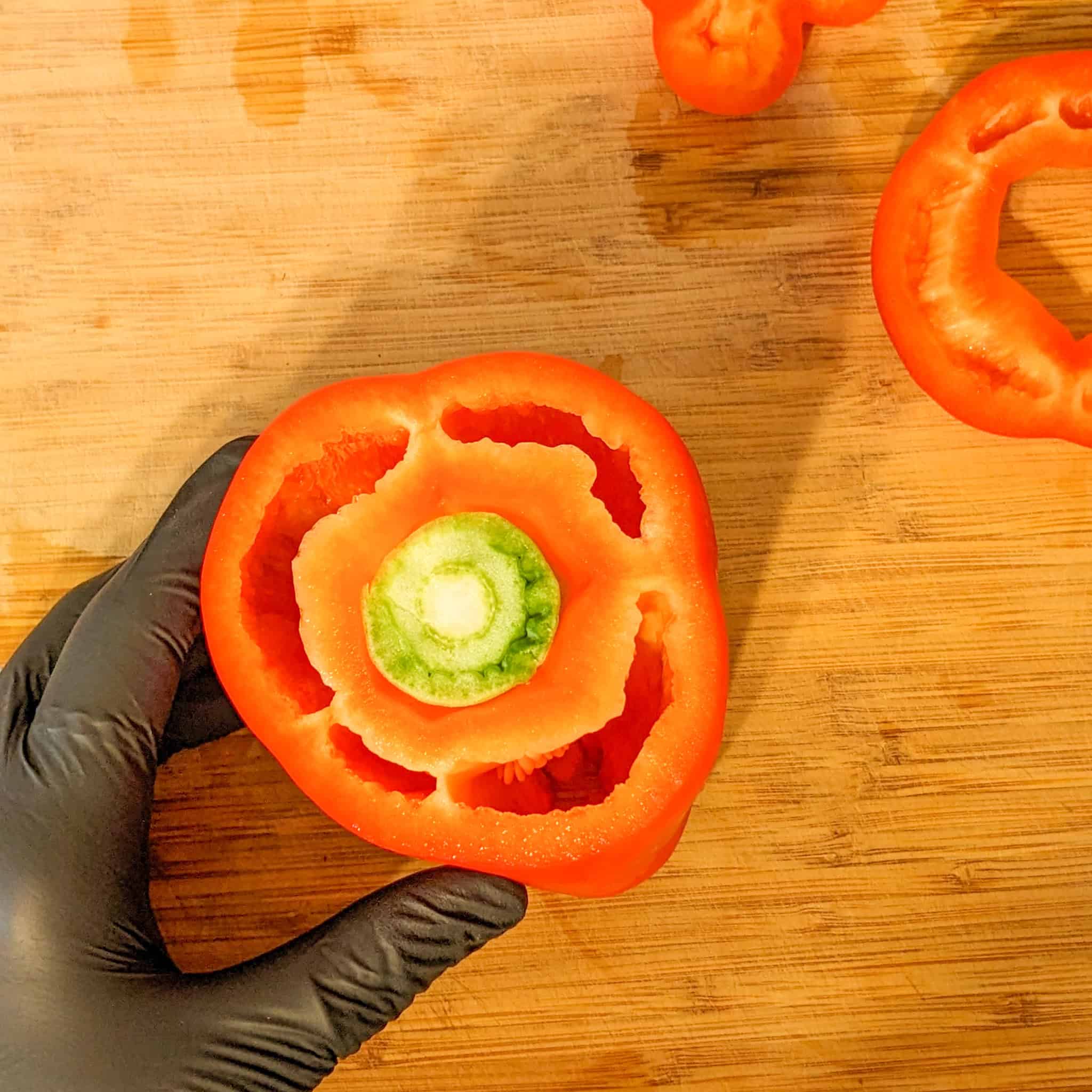 The pepper is placed upright on The Cutting Board.