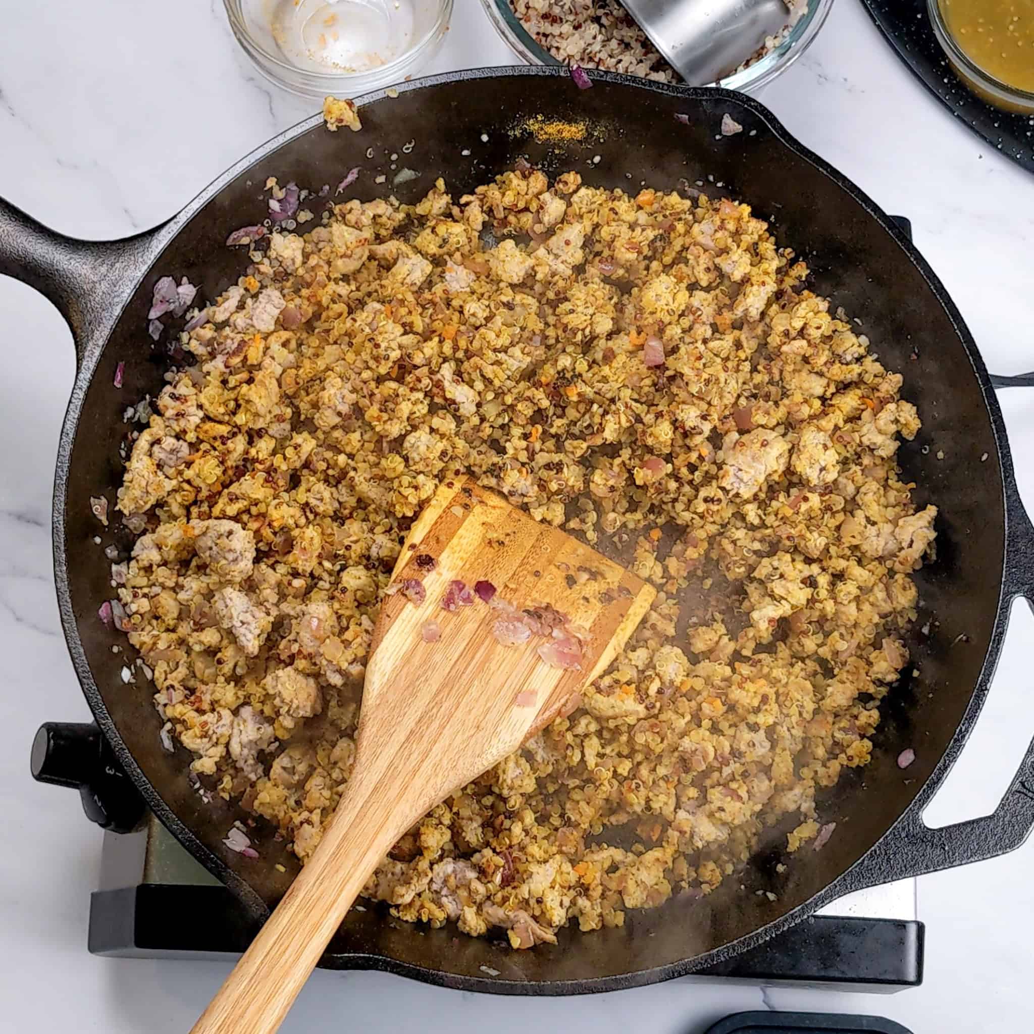 Seasoned ground turkey in a skillet.