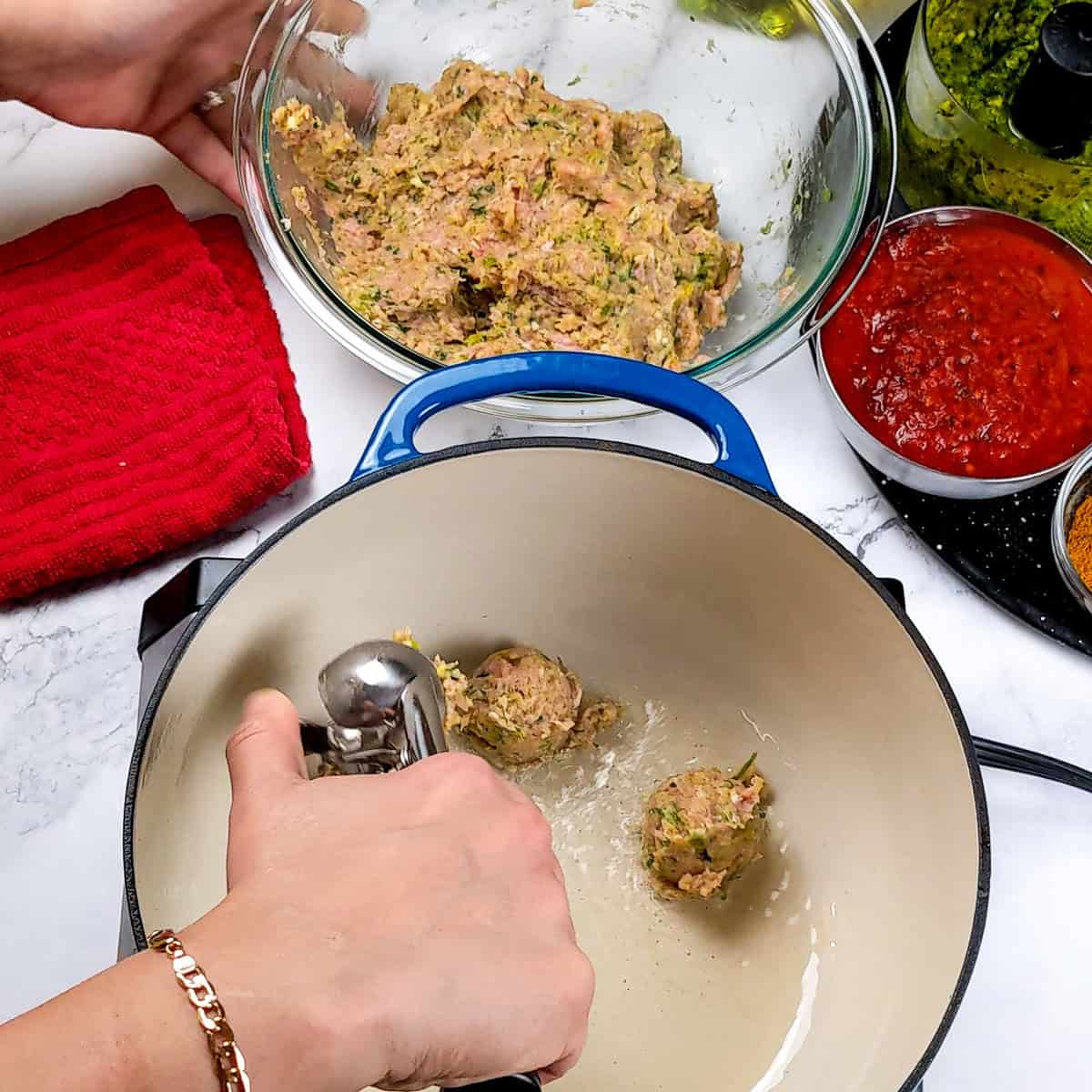 Preparing flavorful turkey meatballs for a delicious curry meatball soup in a cozy kitchen.