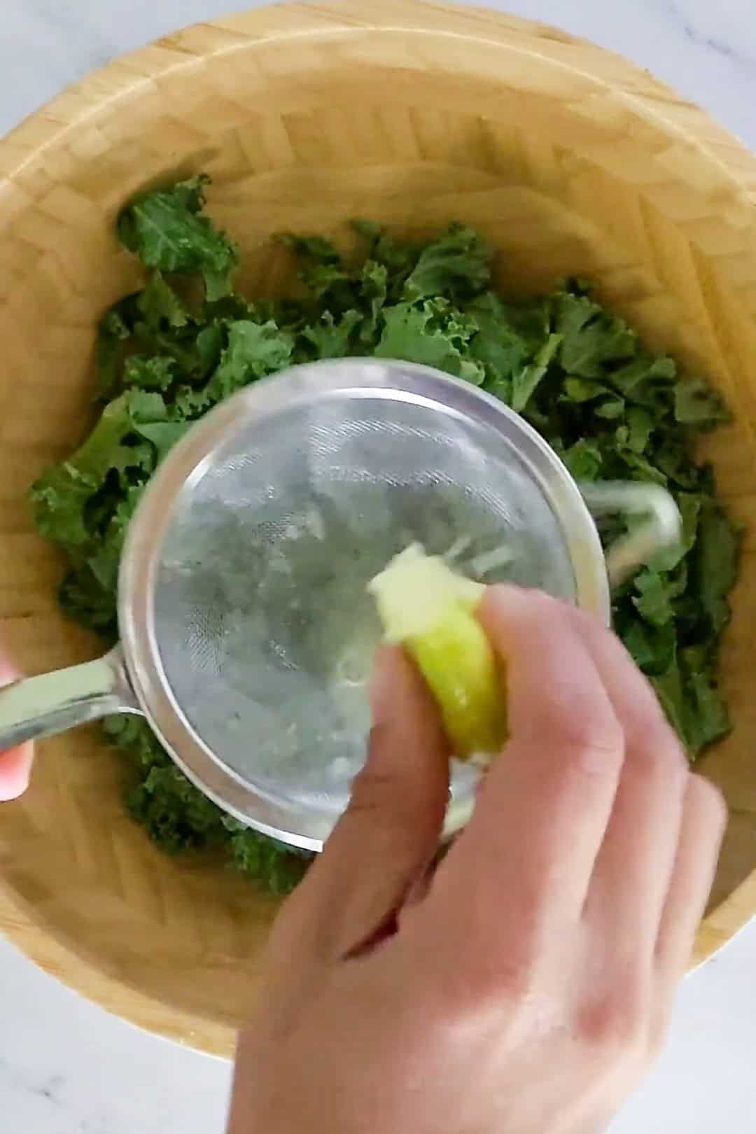 Fresh kale preparation with lime for healthy cooking and nutritious meals.