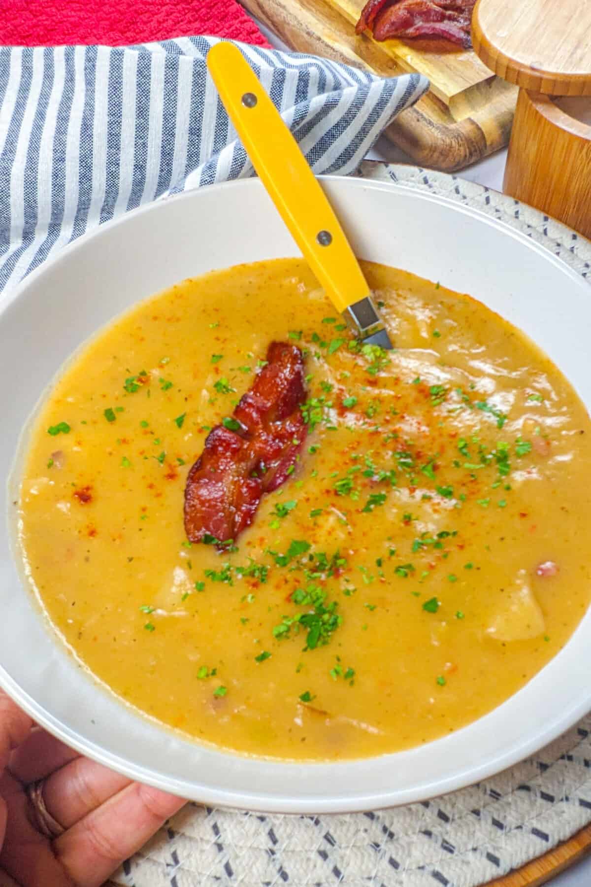 Delicious bacon potato leek chowder, beautifully served in a rustic bowl, perfect for comfort food.