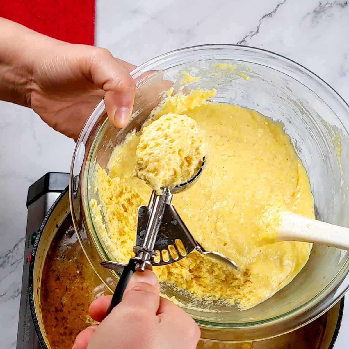 Delicious chicken corn chowder dumplings being prepared, showcasing creamy batter in a mixing bowl.