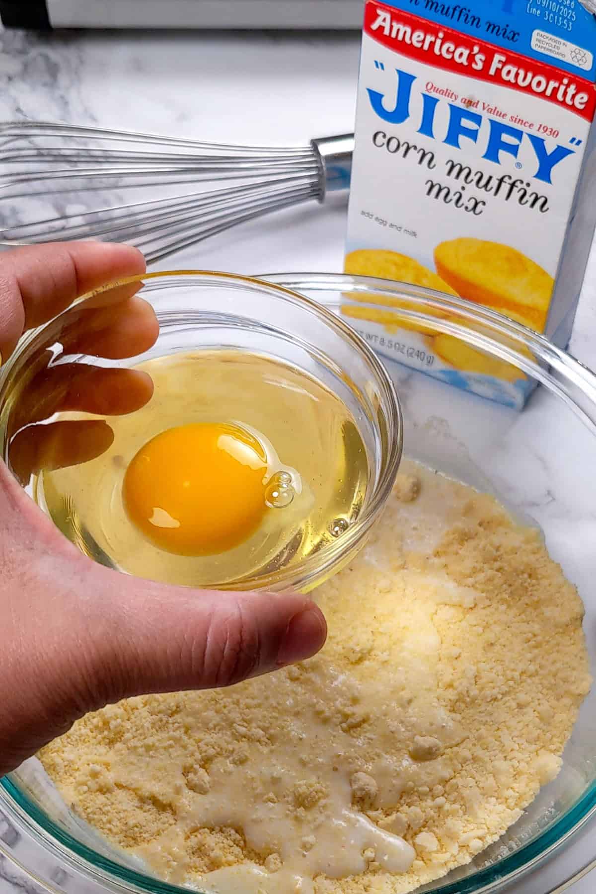 Preparing Jiffy Cornbread Mix with fresh ingredients and a convenient baking mix in the kitchen.