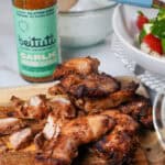 close up of the Beituti Shawarma Chicken Thighs sliced on a cutting board.