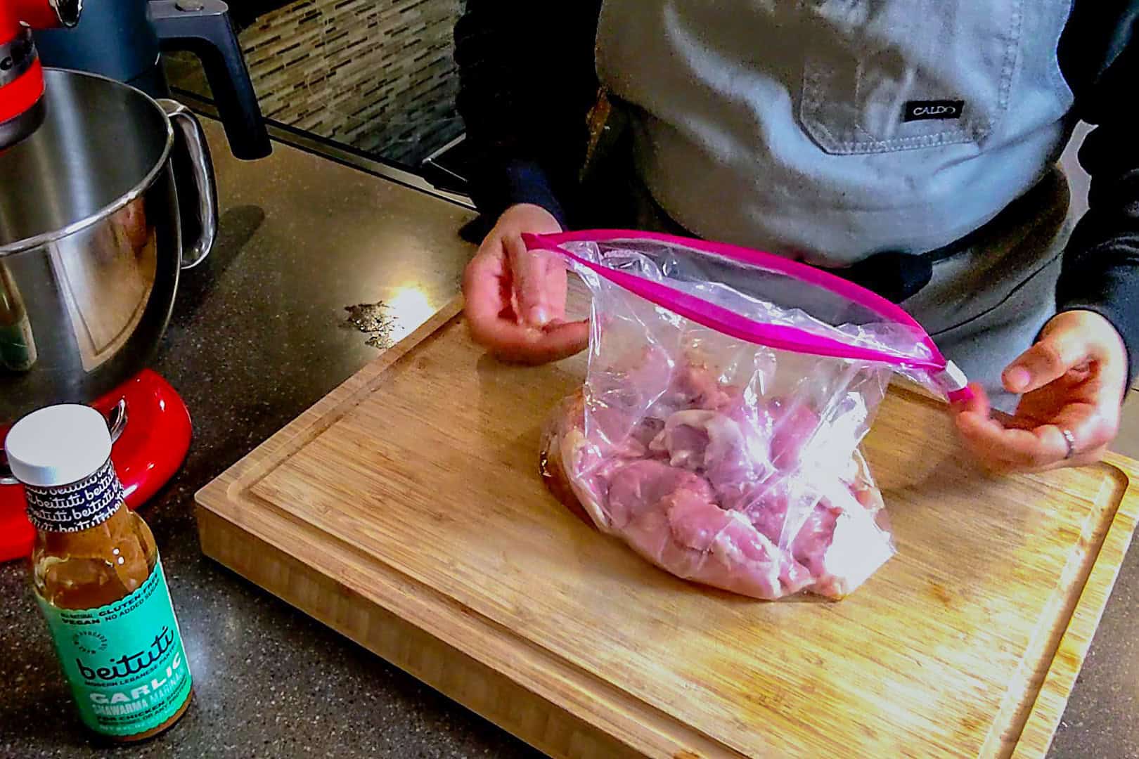 stuffed sealing bag with chicken thighs and marinade.