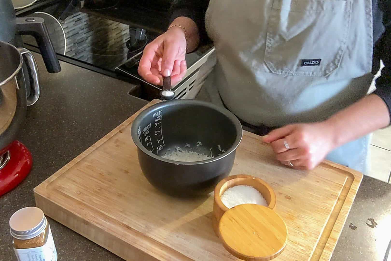 add salt to the rinsed rice that's in the Zojrushi insert.