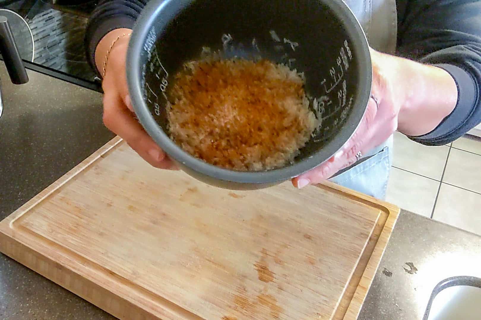 showing the seasoned rice in the rice insert from the rice cooker.