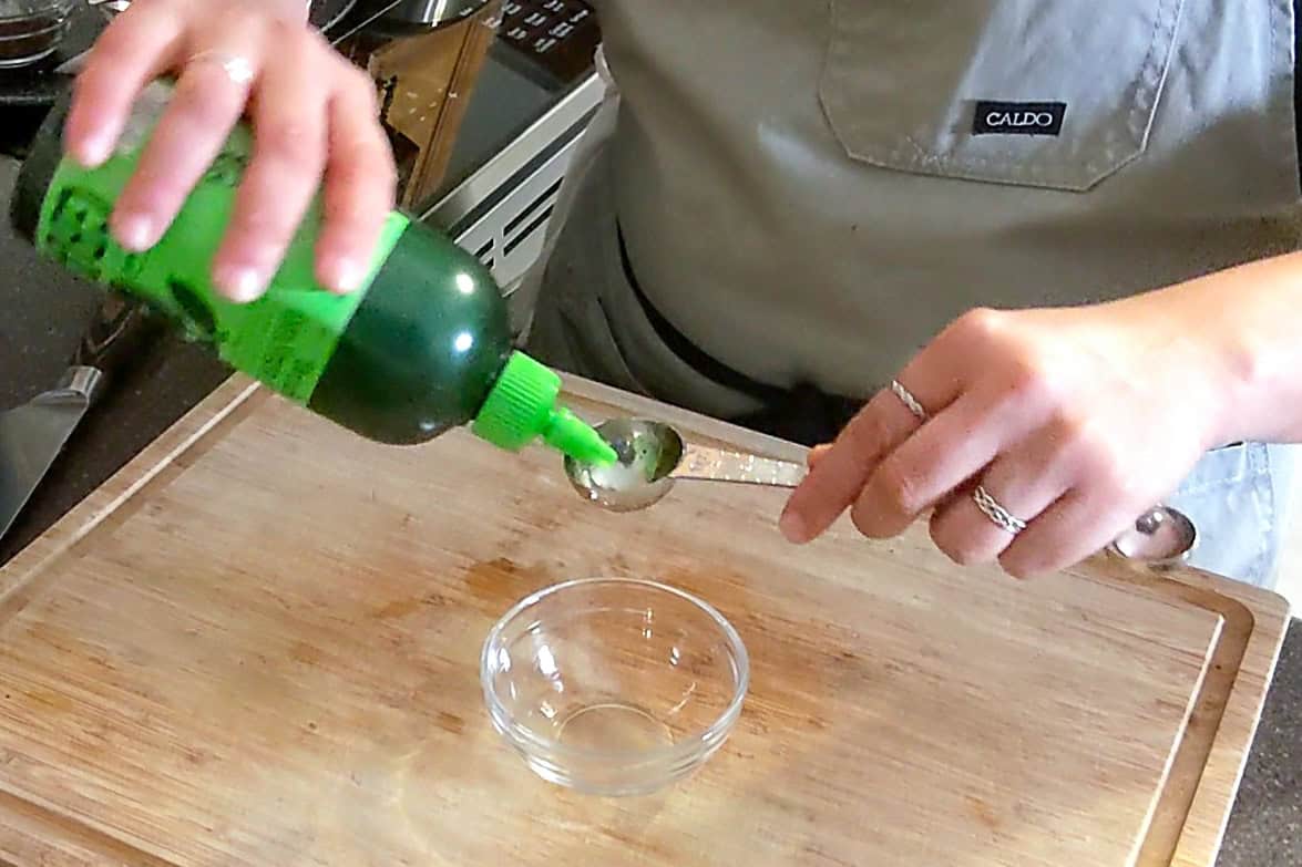 measuring extra virgin olive oil.