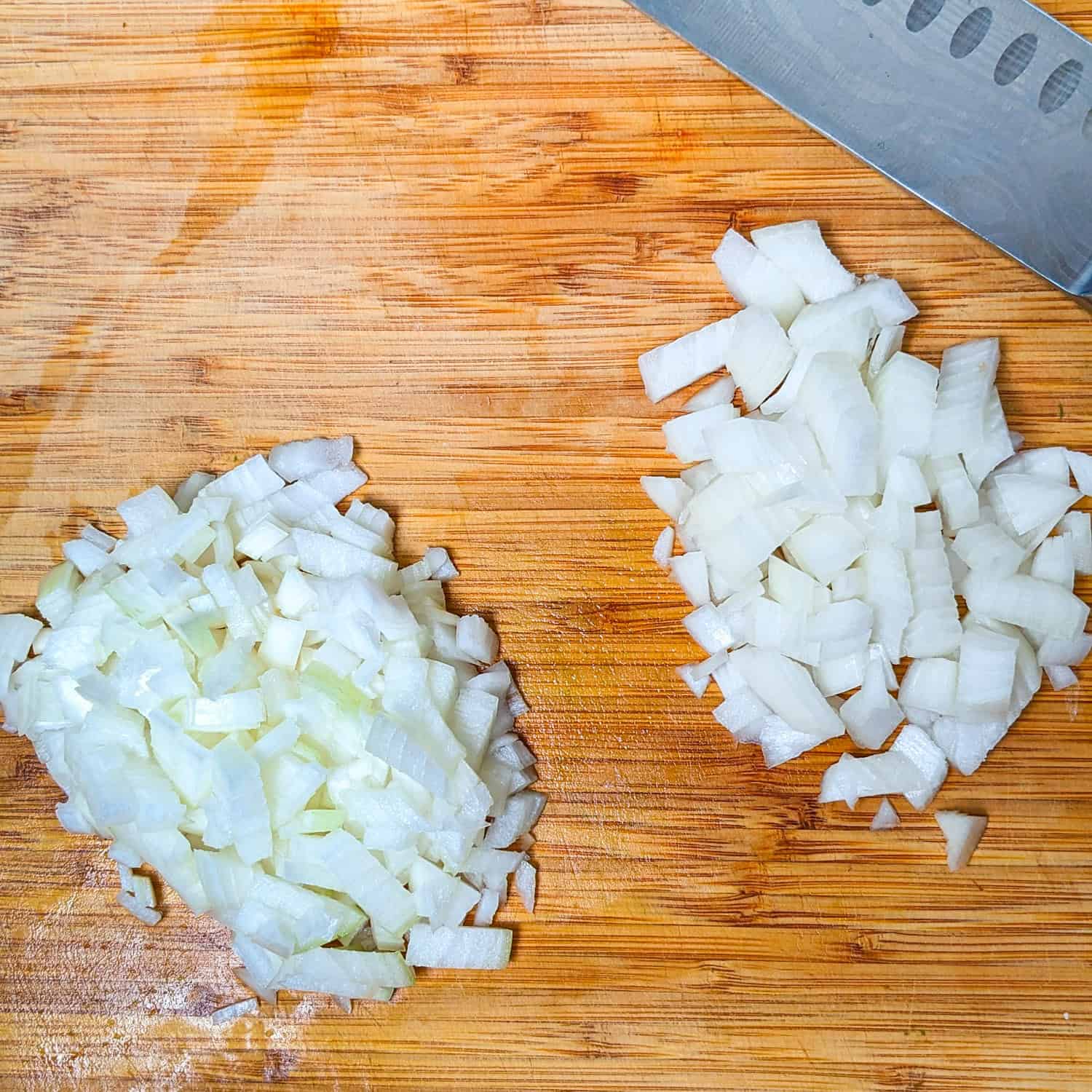 Showing large and small diced onion on a cutting board.