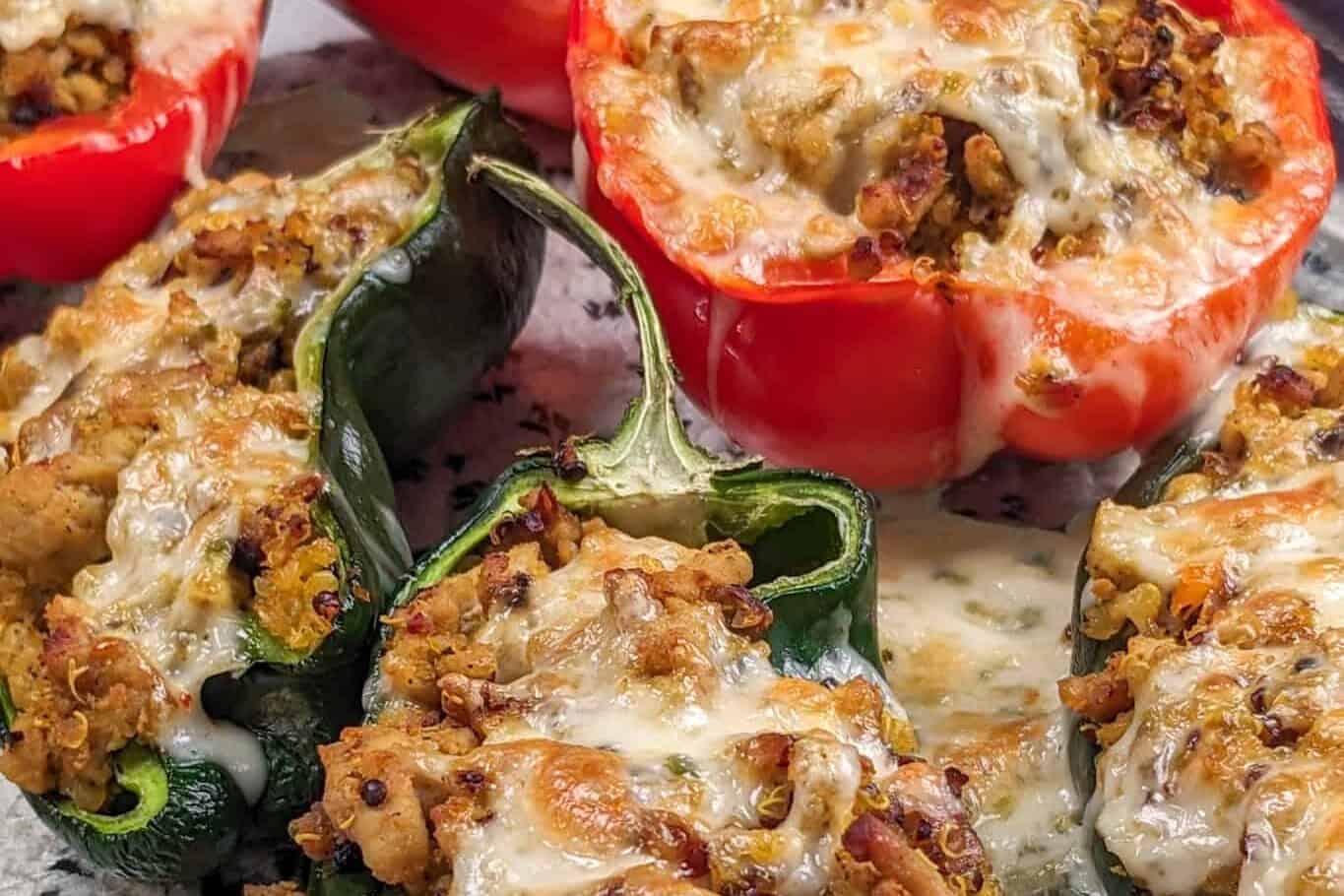 Side view of the baked stuffed peppers resting on the countertop in a glass 13x9-in baking dish.